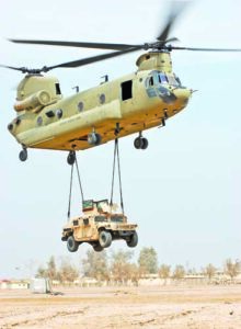 A CH-47F Chinook cargo helicopter from the 2nd Battalion, Combat Aviation Brigade, 4th Infantry Division, Multi-National Division - Baghdad, lifts a Humvee off the ground during a sling load certification training exercise at Camp Taji, March 6. The training was intended to provide Soldiers with the essential skills necessary for sling loading equipment and supplies with a Chinook, the U.S. Army's premiere heavy lift aircraft.