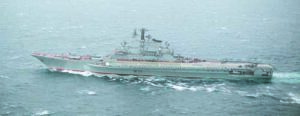 An aerial port beam view of the Soviet Kiev class aircraft carrier MINSK underway.