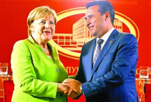 Macedonian Prime Minister Zoran Zaev and German Chancellor Angela Merkel shake hands after a news conference in Skopje, Macedonia September 8, 2018. REUTERS/Ognen Teofilovski