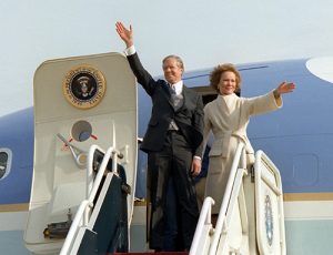 Former President Jimmy Carter and his wife Rosalynn, wave from the top of the aircraft steps as they depart  Andrews Air Force Base at the conclusion of President Ronald Reagan's inauguration ceremony.
